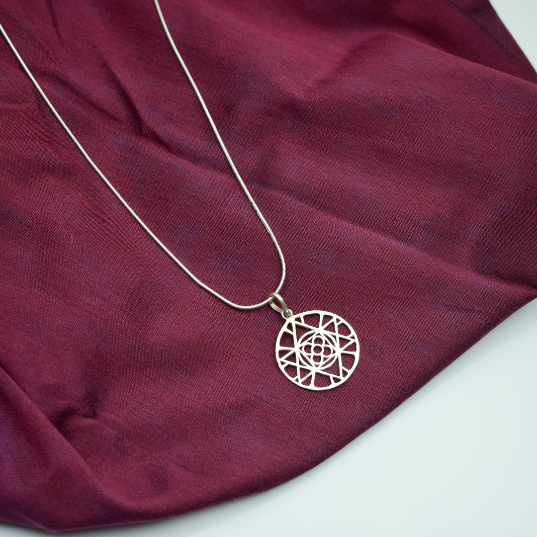 pure silver universal symbol of the mother sri aurobindo ashram pondicherry with silver chain marketed by aura store