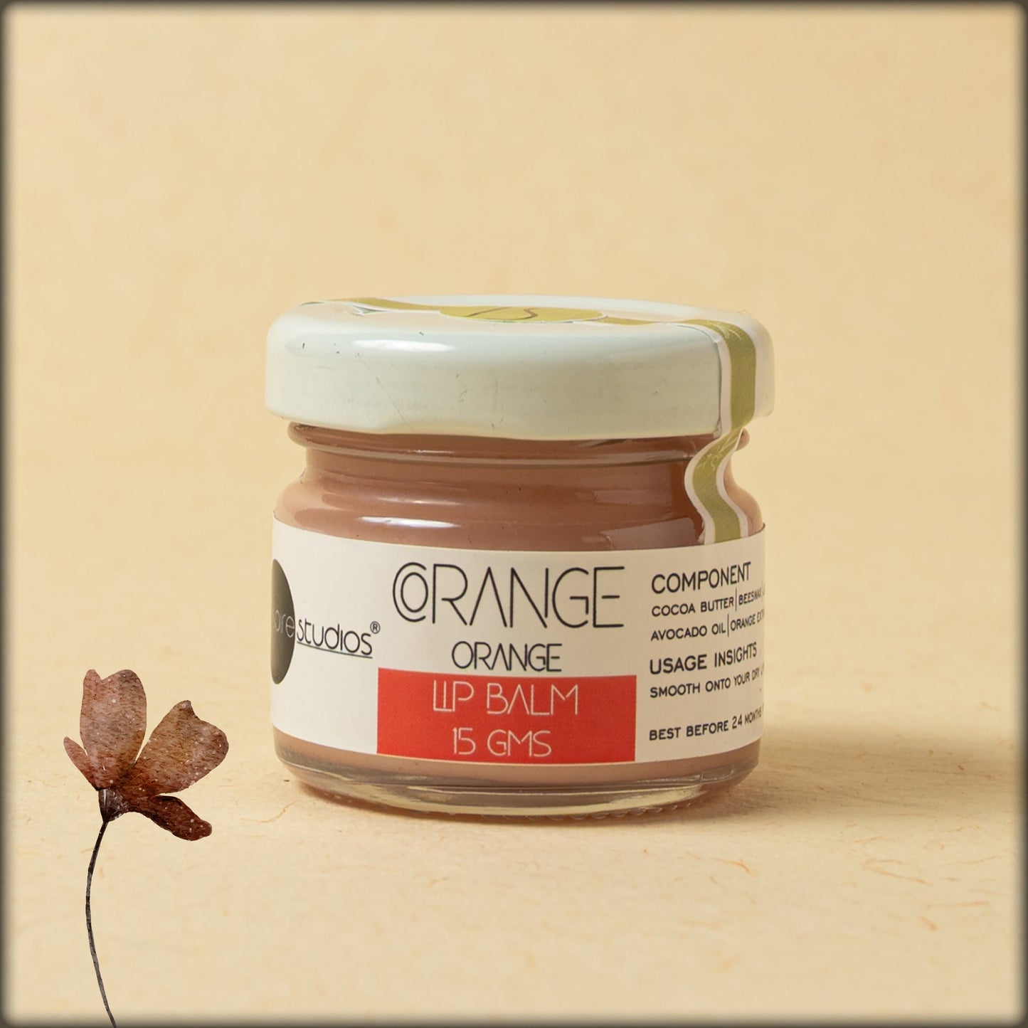 aura corange orange lip balm