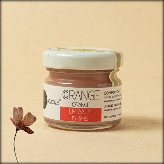 online store organic orange lip balm for smooth onto your dry lips with care, which is cocoa butter, beeswax, jojoba, almond oil, avocado oil and orange extract, best for your dry lips, available at aura experience store puducherry
