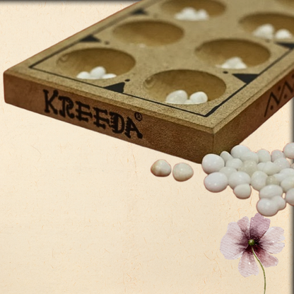 pallanguzhi - traditional 2 player board game
