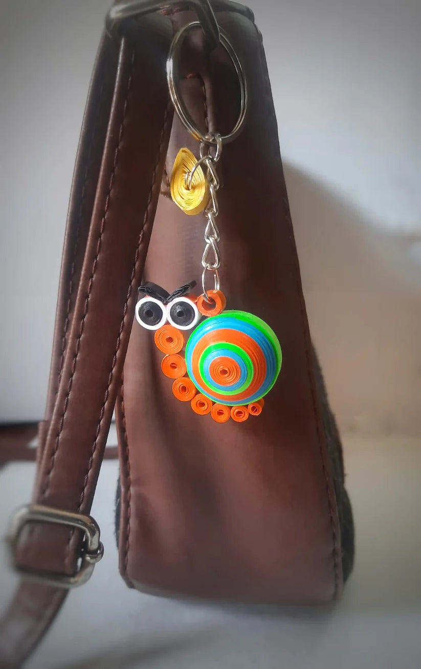 paper-quilled-cartoon-character-hand-designed-snail-keyring-accessorizing-bags-keys-by-aura-puducherry-from-sri-aurobindo-ashram