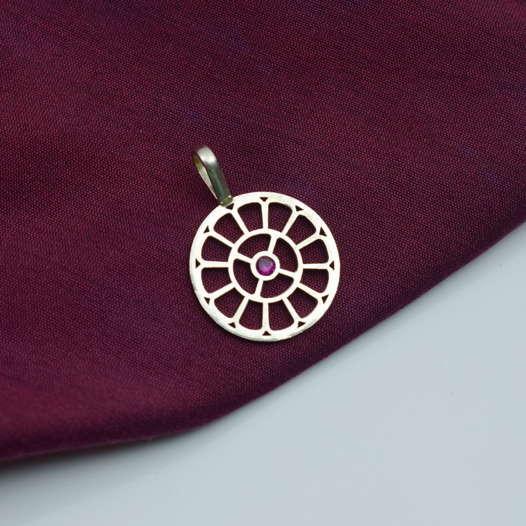 the mother symbol silver pendant with pink stone of sri aurobindo ashram pondicherry marketed by aura store