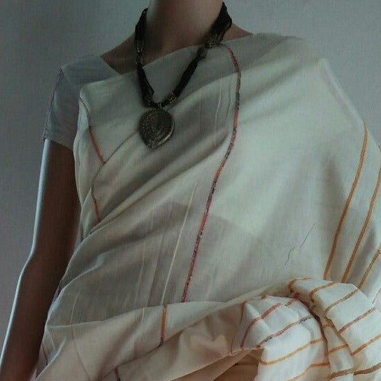 white color khesh saree draped over mannequin